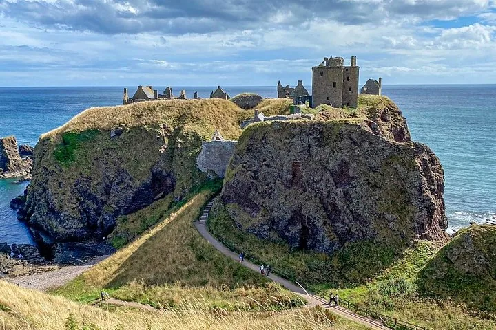 Dunnottar Castle ruins situated on a dramatic clifftop peninsula overlooking the ocean